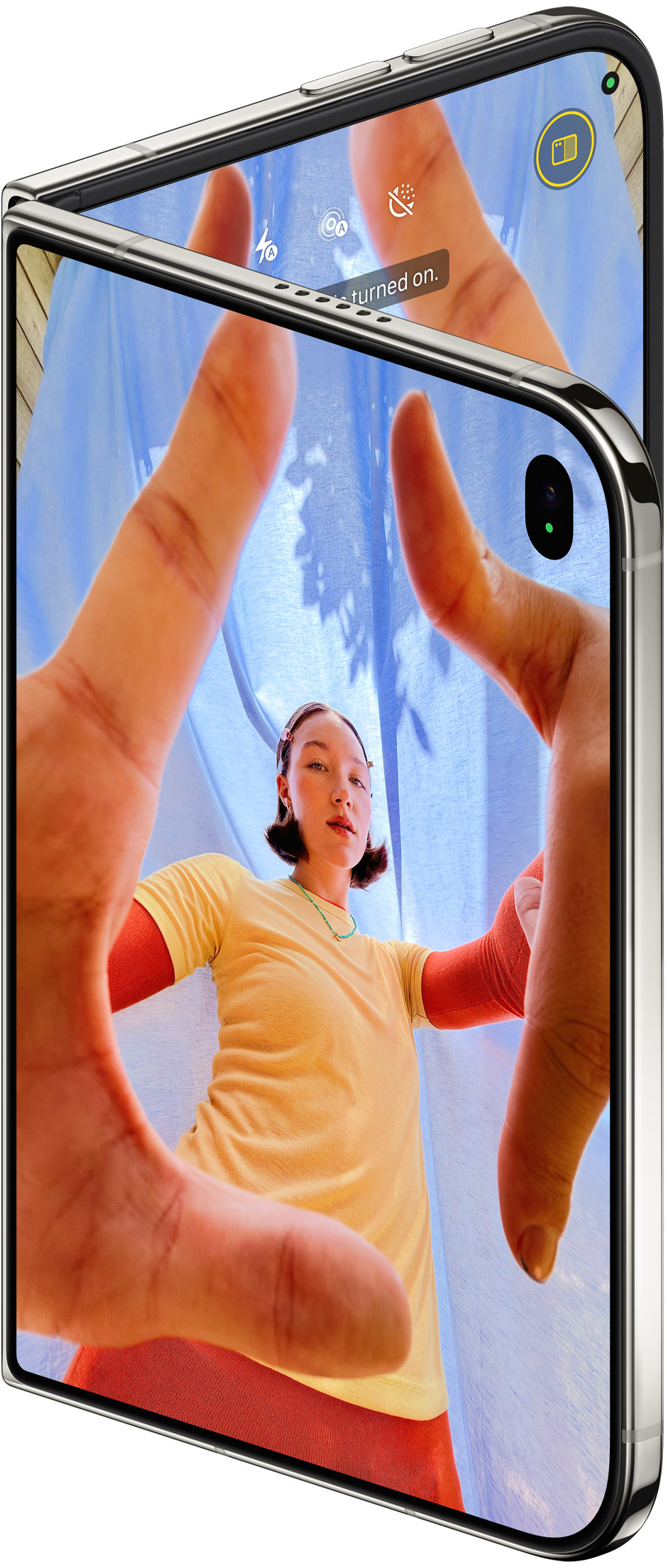 iPhone Duo, Star White, slightly open showing the cover display